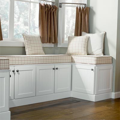 custom window seat designed using kitchen cabinets