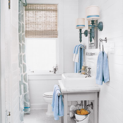 white bathroom with salvaged under sink storage and matching details