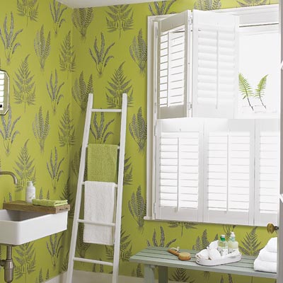 bathroom with green coated wallpaper