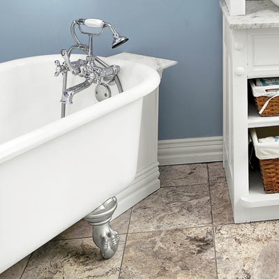 a homemade tub shelf with a marble top