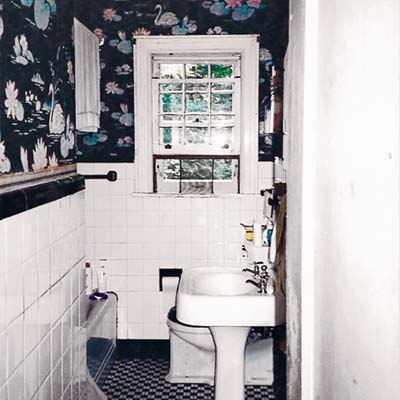 before photo of a Tudor-style bath remodel showing a cramped space