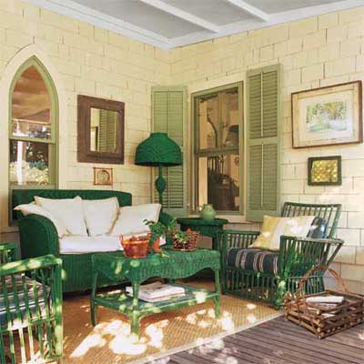 a porch with wicker furniture and rustic accents