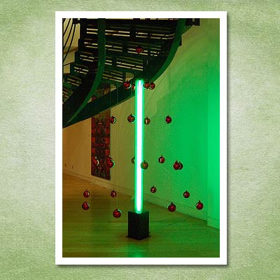christmas tree made out of neon pole and ornaments