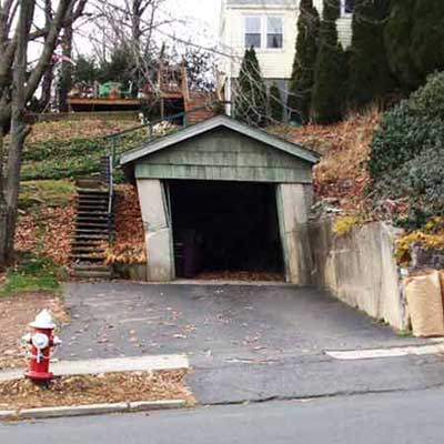 a garage looks like it's tilting perilously