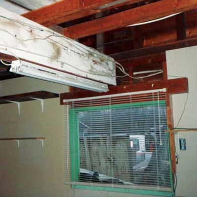 a load-bearing joist is supported by a 2x6 in order to accommodate a window