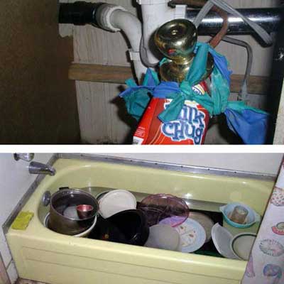 plumbing pipes held together with balloons, an electrical plug, a carton of 'Milk Chug' and a doorknob and a bathtub filled with dishes