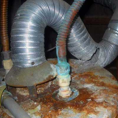 a water heater riddled with rust, a torn ventilation shaft, copper pipes that have oxidized