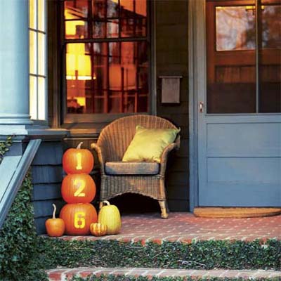 decorated pumpkins used as themed house numbers