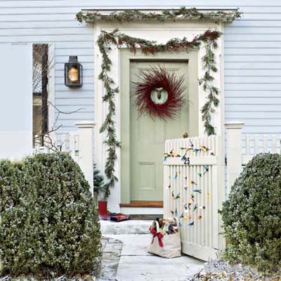 retro style holiday lights strung to an entry gate
