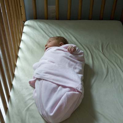 child home safety, child-proofing, and accidental injury prevention in the bedroom, nursery, crib: baby sleeping in crib