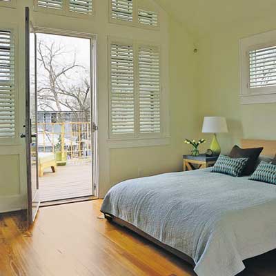 upstairs bedroom with salvaged wood floor