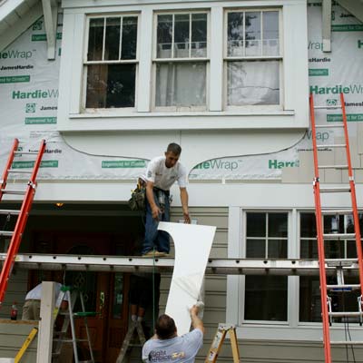 installing the teardrop design on the second floor window apron