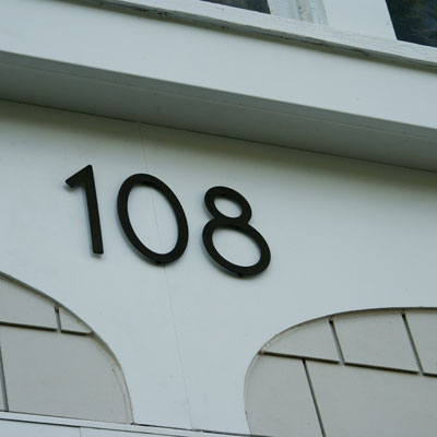 a detail of the house numbers on the front exterior