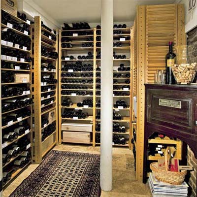open wine racks built into a room of this remodeled basement make a fine wine cellar