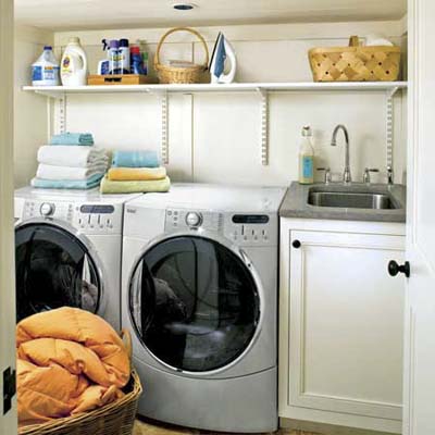 a corner laundry nook built in this remodeled basement