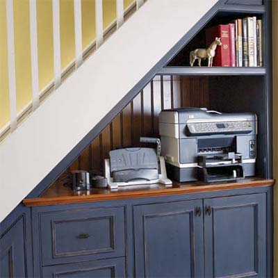 shared print station for the homework center built under the stairs as part of this basement remodel