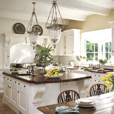 Open white kitchen has rustic charm