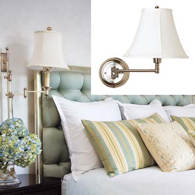 sconce light positioned over bed