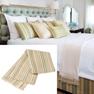 a striped throw is perfect for the foot of the bed