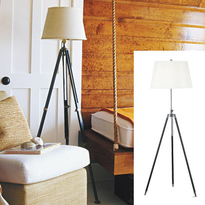 cabin style bedroom with tripod lamp