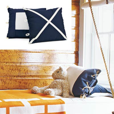 cabin style bedroom with graphic nautical style accent pillows