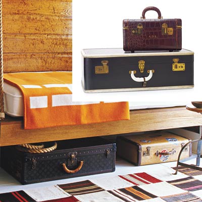 cabin style bedroom with vintage suitcases