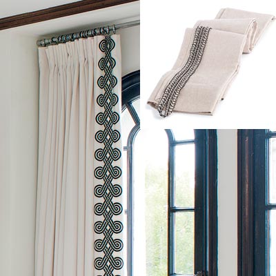 well furnished living room with trimmed drapes