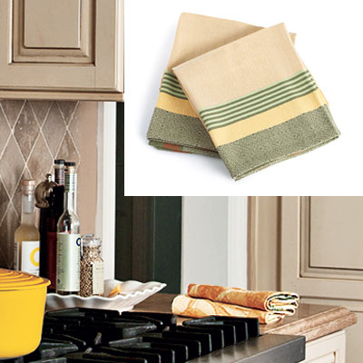 taupe kitchen with gold and green dish towels