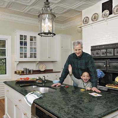 man and his son at the kitchen island in their remodeled kitchen