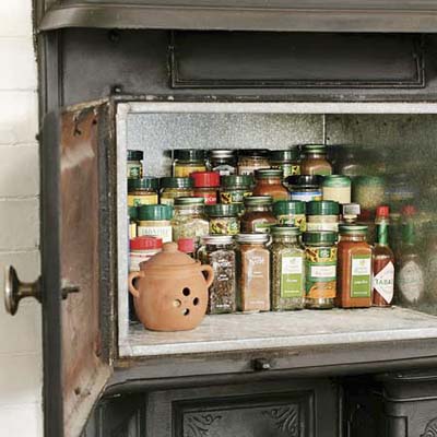 handy storage for spices and other small items in this remodeled kitchen