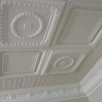 the existing embossed metal ceiling tiles in this remodeled kitchen