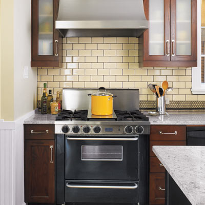 period style kitchen with stainless steel range and hood with granite countertops