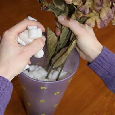 use a packing peanuts to fill the bottom of a deep vase