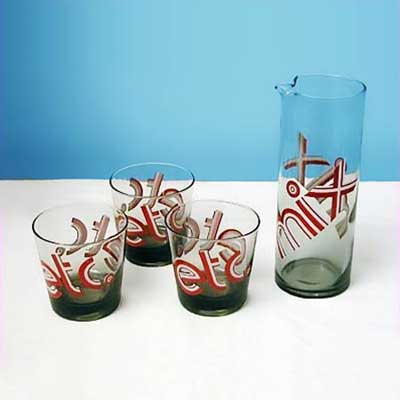a 70s style martini pitcher and matching glasses