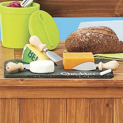 tile cheese board with different kinds of cheese