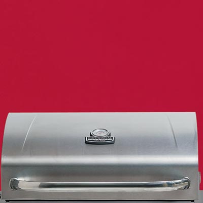the Char-Broil Commercial Series four-burner propane grill close up on the lid