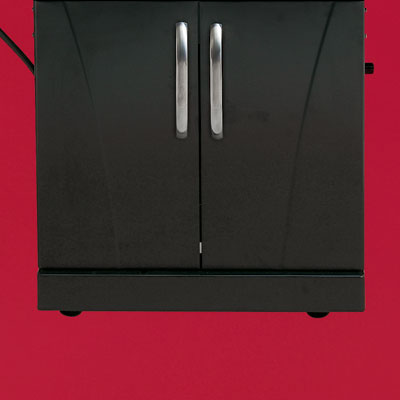 the Char-Broil Commercial Series four-burner propane grill close up on the cart