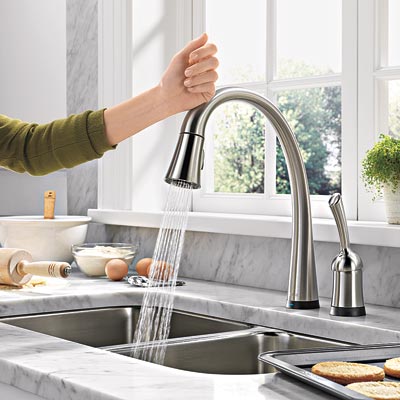 woman turning off hands free delta pilar touch faucet