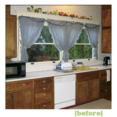 kitchen of this victorian and craftsman style cottage showing the existing cabinets before remodel
