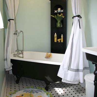 chic bathroom with black claw foot tub