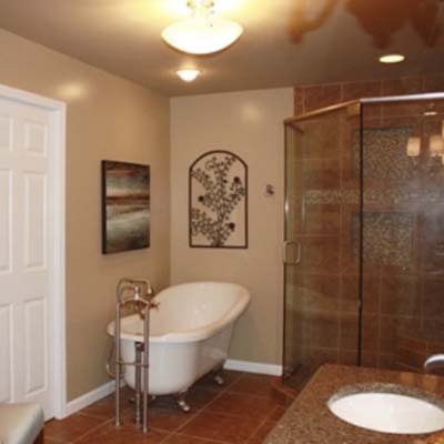 updated bathroom with shower and claw foot tub
