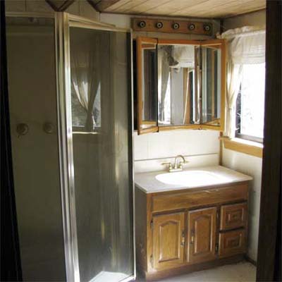 outdated bathroom with stall shower
