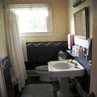 outdated bathroom with wallpaper
