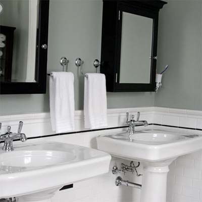 remodeled bathroom with two pedestal sinks