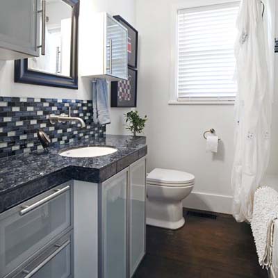 remodeled bathroom with tiled backsplash