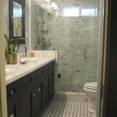 remodeled bathroom with tiled backsplash