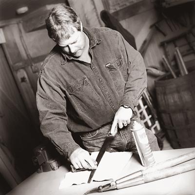 man cleaning a bypass tool