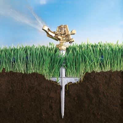 pulsating sprinkler planted in grass and soil