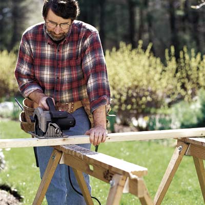 man using circular saw