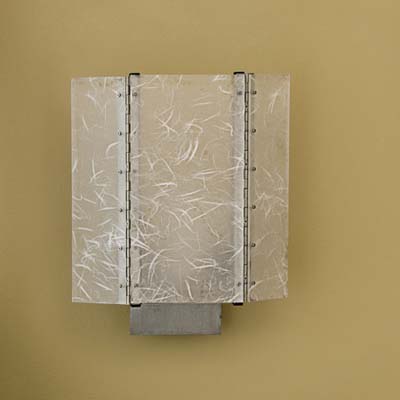 Fitted with an energy-efficient compact fluorescent lamp, the Flipster sconce has hinged side panels that swing open and shut, so you can direct light where you want it.